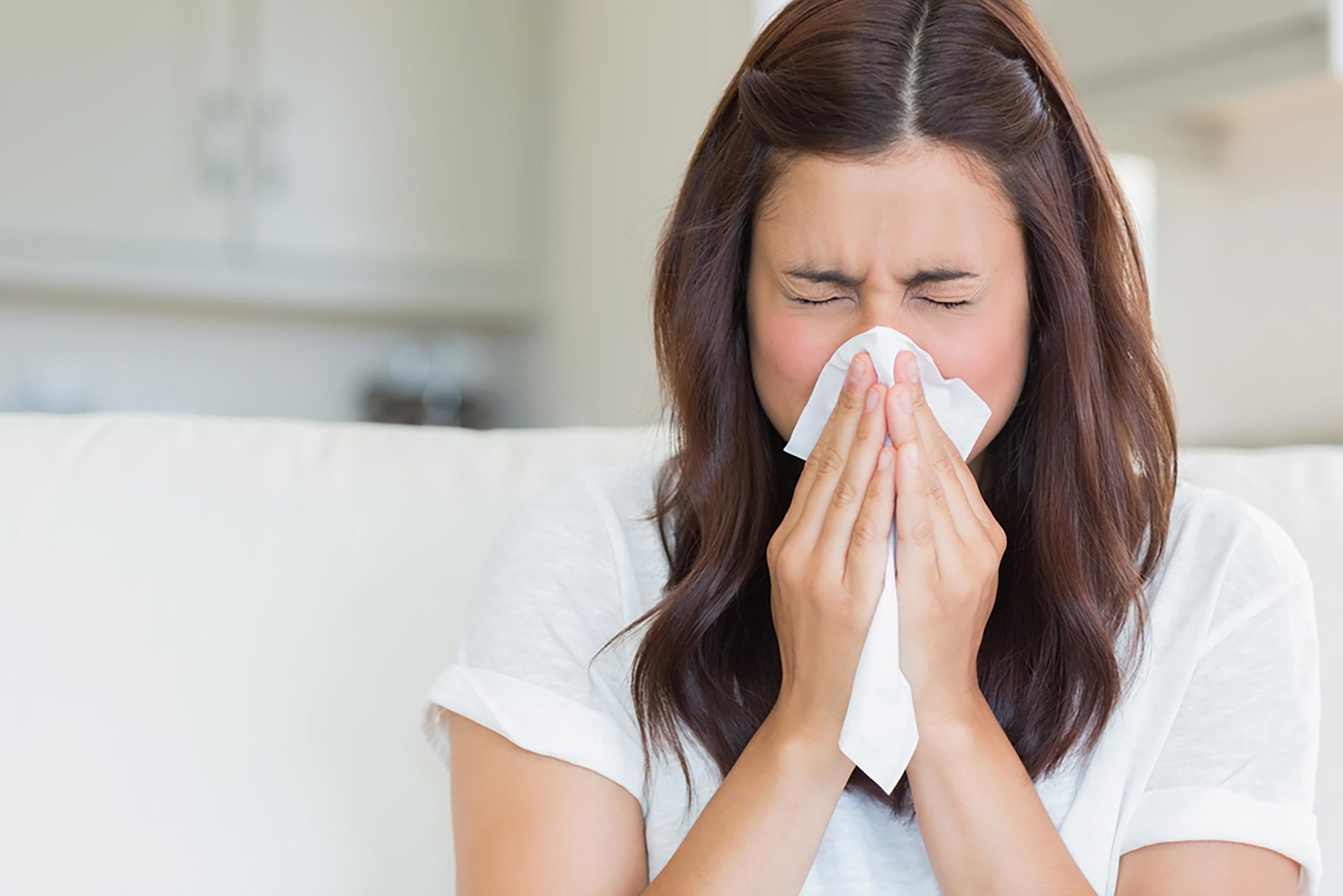 sneezing and woman blowing nose
