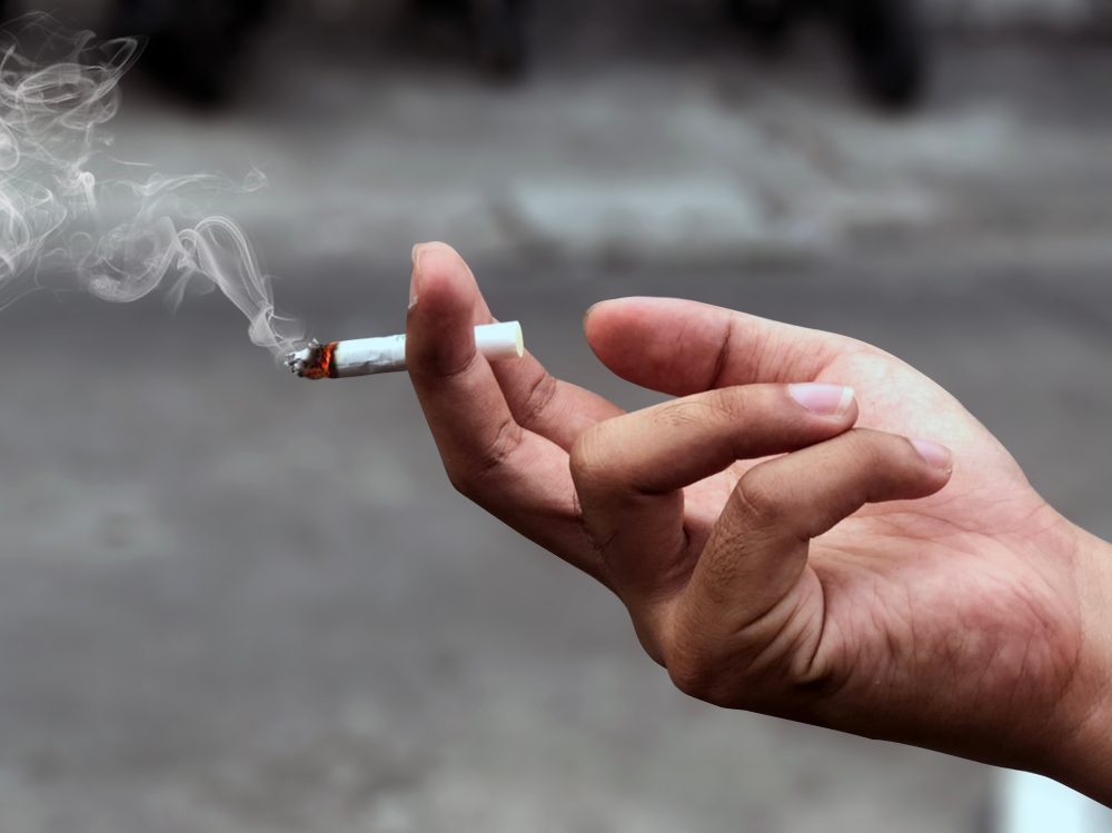 hand holding a cigarette