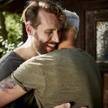Two happy men embracing