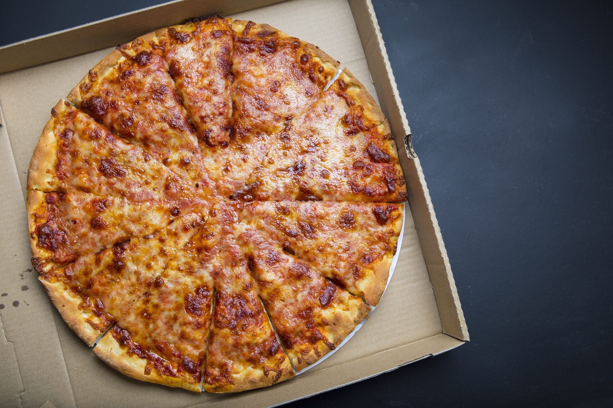 Delicious Cheese Pizza fresh from the oven in a box