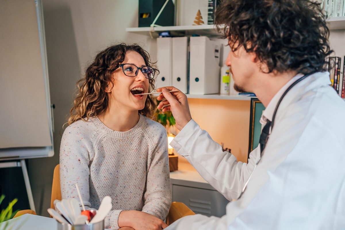 dentist checking female patient