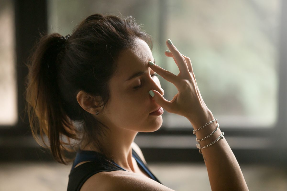 woman doing breathing exercise
