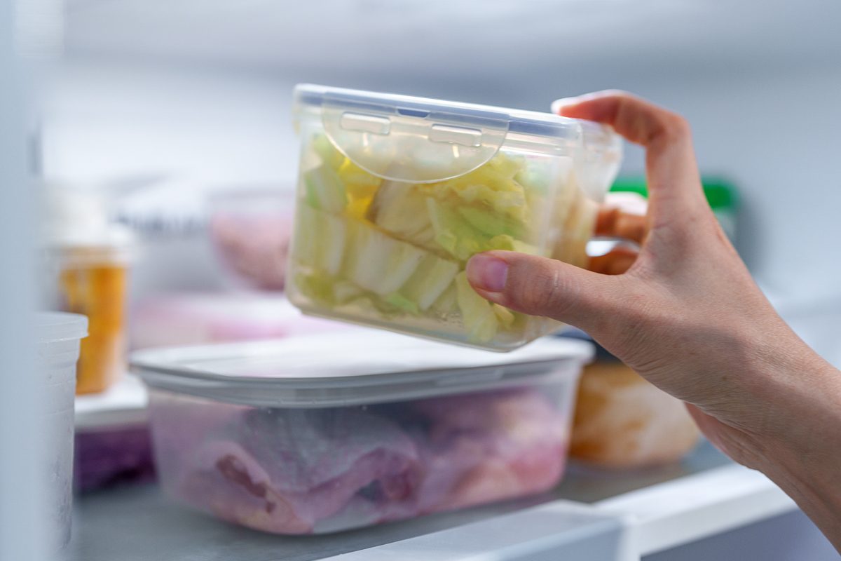 specialty container for food being put inside the fridge
