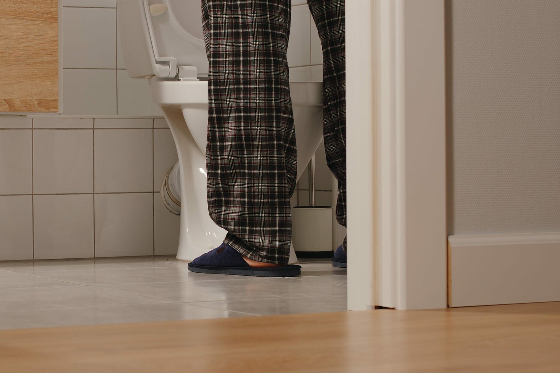 Adult man in a toilet at home