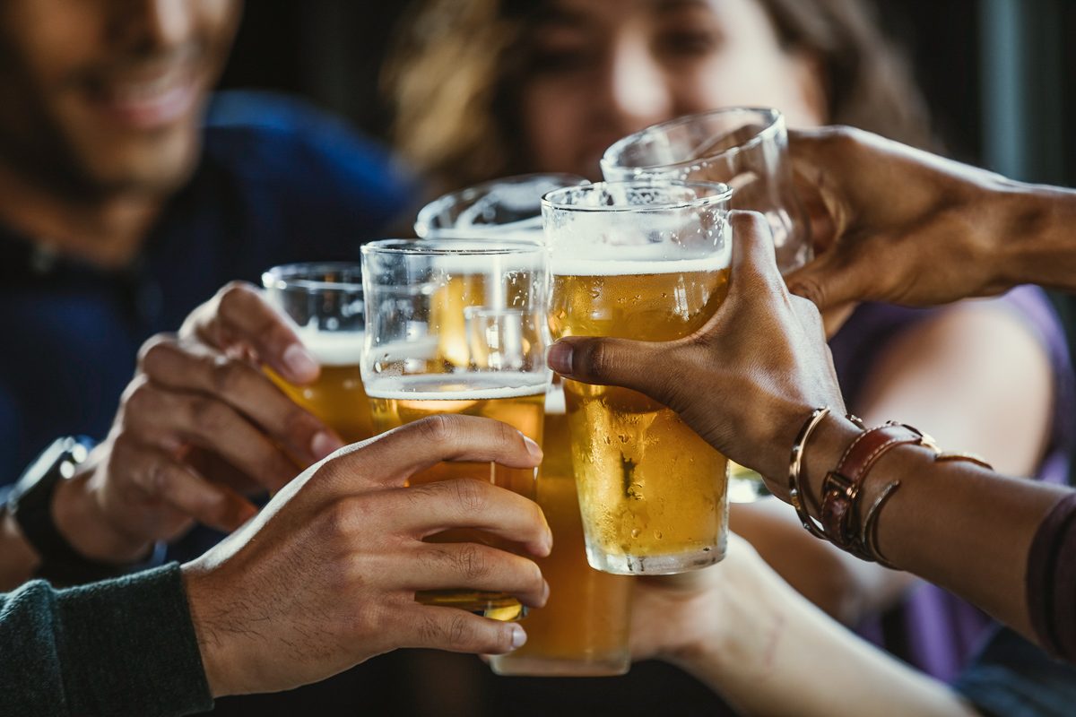 group of friends toasting beer glasses