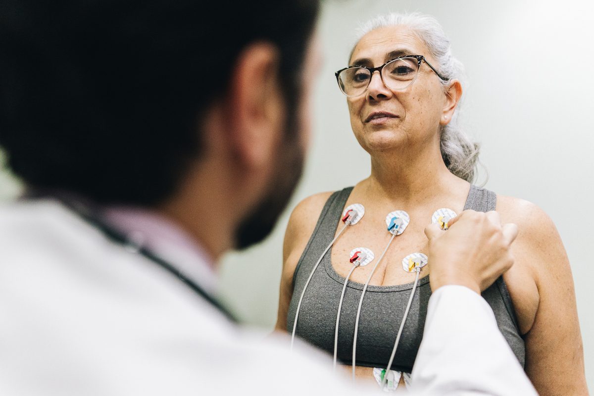 Patient talking with her doctor during a cardiopulmonary stress test